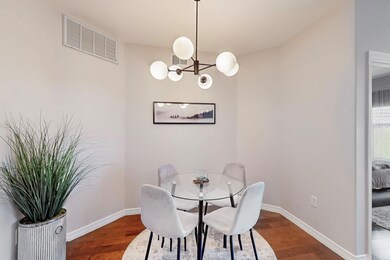 Dining room featuring baseboards, visible vents, a
