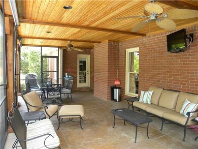 THE LARGE SCREENED PORCH FEATURES A WALL MOUNT FOR