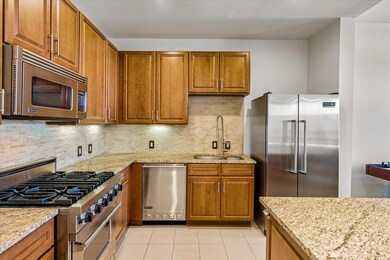 Kitchen featuring a sink, high end appliances, and