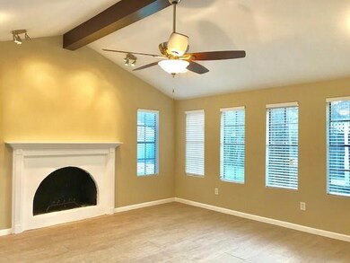 Family room with lots of windows, vaulted ceiling