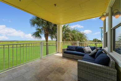 Step outside to your expansive covered balcony, perfectly positioned for enjoying salty breezes, beautiful views, and relaxed outdoor living.