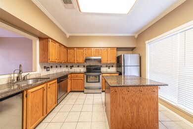 Granite countertop, stainless steel appliance, and