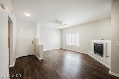 Unfurnished living room featuring a glass covered