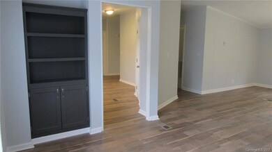 Built in cabinet in dining area provides extra storage space.