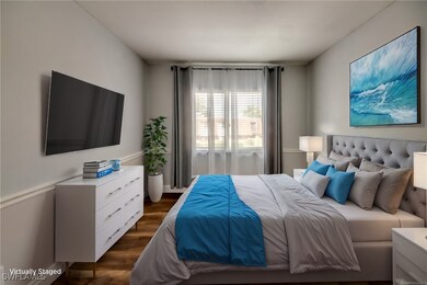 Bedroom with dark wood-style floors