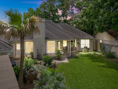 Charming home with a welcoming path leading to a g