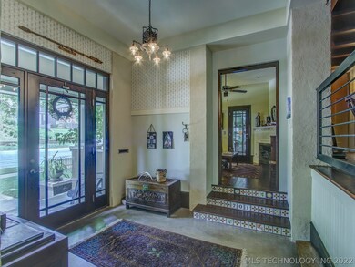 3 step up to office w/ fireplace. Entry to garden