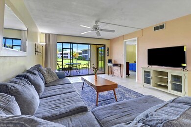Tiled living room with ceiling fan