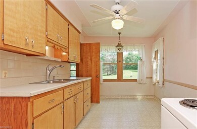 15'x9' kitchen. Door to basement stairs and back e