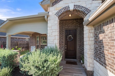 Doorway to property with brick siding