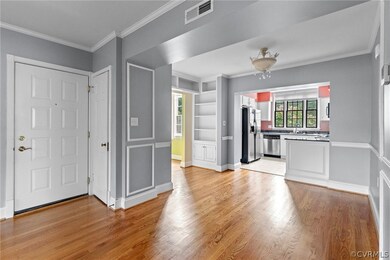 Unfurnished living room featuring light hardwood /