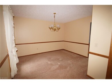 Dining room with chair rail right off the foyer an