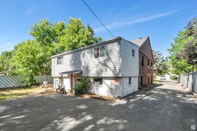 View of side of property featuring driveway