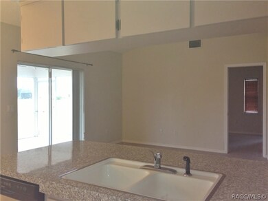 From kitchen toward  living - door to master bedro