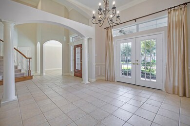Stunning formal dining room with French doors leading to the front porch.