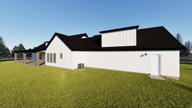 Back of property with a lawn