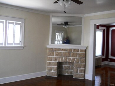 Living room with ornamental fireplace and ceiling 