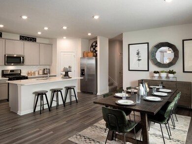 Dining area featuring dark wood-type flooring, st