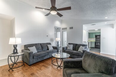 Notice the engineered wood flooring throughout the unit
