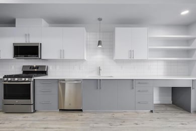 Kitchen featuring appliances with stainless steel