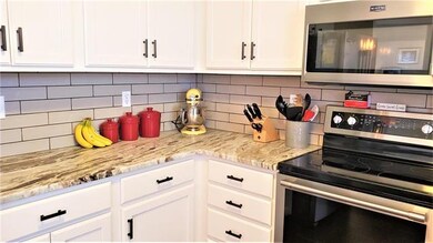 Subway back splash and great granite counter tops.