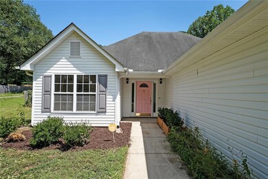View of front of property with a shingled roof