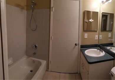 master bathroom with door access to the laundry ro