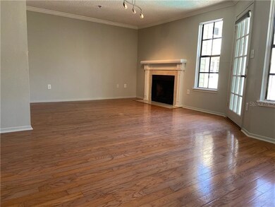 Living room with wood floor and wood-burning firep