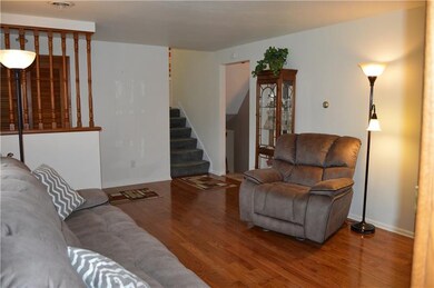 Living room with access to upstairs bedrooms and l