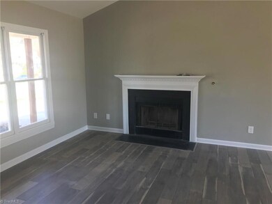 Living room:  Vinyl plank floors, vaulted ceiling and fresh interior paint.