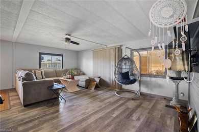 Living room featuring a textured ceiling, ceiling 