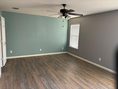 Unfurnished room with dark wood-type flooring and 