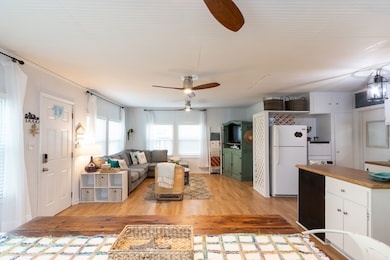 This bright and cozy open-concept living space fea