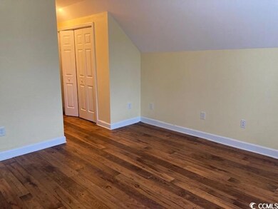 Additional living space with dark wood finished fl