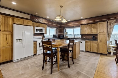 Travertine tile beneath the kitchen could be re-ex