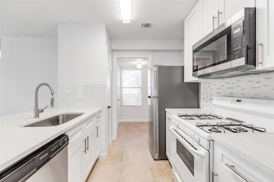 Kitchen featuring appliances with stainless steel