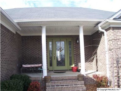 Covered front porch with plenty of room for furnature.