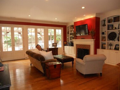 Spacious family room with hardwood floors, gas fir