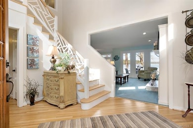 Stunning 2-story foyer with hardwood floors and a 