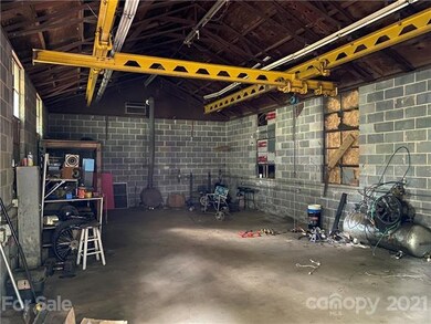 The garage offers a large, secure space for worksh