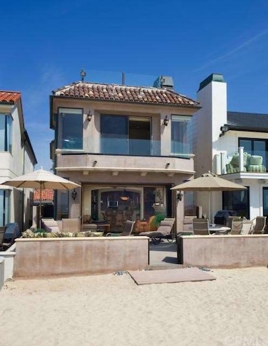 Oceanfront Face of Home with Large Beachside Patio