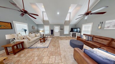 Living room with high vaulted ceiling and ceiling 