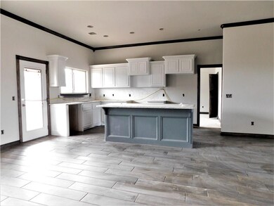 Under construction.  Kitchen and dining areas.