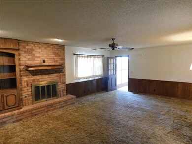 Large living room, built in bookcase and fireplace