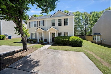 View of front of property featuring a front lawn