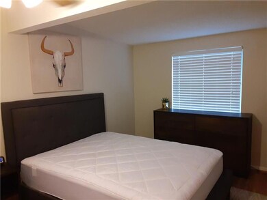 Bedroom with wood finished floors