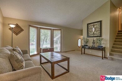 Offers Vaulted ceiling with bay window and formal dining.  New floor coverings throughout home and paint.