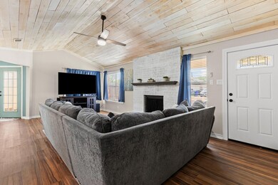 Living room with wooden ceiling, ceiling fan, dar