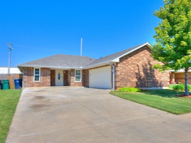 Ranch-style home with brick siding, driveway, a front yard, and roof with shingles