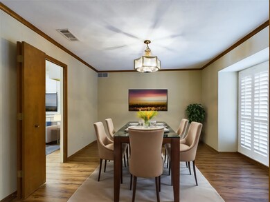 Dining space with a chandelier, wood-type Dining r